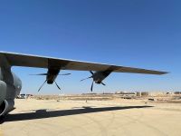This picture taken on July 8, 2021 shows a view of the wing of a C-130 Hercules turboprop military transport aircraft on the runway at Ain al-Assad air base, which hosts US forces in Iraq in the western Anbar province, a day after fourteen rockets were fired at the base. Fourteen rockets were fired on July 7 at an air base hosting American troops in the western province of Anbar, causing minor injuries to two personnel, the coalition said. AFP Iraq keeps limited U.S. advisers as most American troops shift to Kurdistan