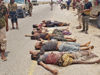 Graphic content / Yemeni security personnel inspect the bodies of dead members of al-Qaeda who were shot after launching an attack on a security checkpoint of the UAE-trained Security Belt group in Ahwar district of the southern province of Abyan on September 6, 2022. AFP Al-Qaeda suicide attack on government compound in Yemen’s Abyan leaves 10 dead