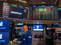 Traders work on the floor of the New York Stock Exchange (NYSE) on October 29, 2025 in New York City. Markets were up in morning trading as investors expect that the Federal Reserve will announce a quarter-point cut to its benchmark interest rate later in the day. AFP Fed cuts interest rates again to boost slowing job market