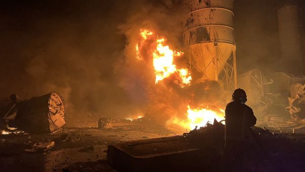 A firefighter douses the flames of a fire that took over a cement manufacturing complex following a series of Israeli airstrikes, in the village of Ansar, near Doueir, southern Lebanon, on October 16, 2025. AFP Israeli drone strike kills two brothers in southern Lebanon