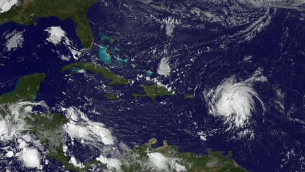 This October 13, 2014 NASA GOES Project satellite photo shows Tropical Storm Gonzalo(Lower-R) near the Leeward Islands in the western Atlantic Ocean. Tropical Storm Gonzalo gained strength Monday, prompting hurricane watch advisories for Puerto Rico and the Virgin Islands, forecasters said. The storm was expected to become a hurricane by nighttime or Tuesday, the National Hurricane Center in Miami said in its latest bulletin. AFP 6.5-magnitude earthquake rattles Leeward Islands
