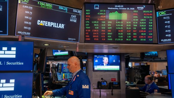 Traders work on the floor of the New York Stock Exchange (NYSE) on October 29, 2025 in New York City. Markets were up in morning trading as investors expect that the Federal Reserve will announce a quarter-point cut to its benchmark interest rate later in the day. AFP Fed cuts interest rates again to boost slowing job market