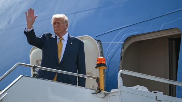 U.S. President Donald Trump waves as he departs on Air Force One from Kuala Lumpur International Airport in Sepang on October 27, 2025. Photo by ANDREW CABALLERO-REYNOLDS / AFP U.S. President Donald Trump