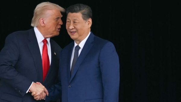 US President Donald Trump (L) and China's President Xi Jinping shake hands as they leave after their talks at the Gimhae Air Base, located next to the Gimhae International Airport in Busan on October 30, 2025.Photo by ANDREW CABALLERO-REYNOLDS / AFP Trump meets Xi